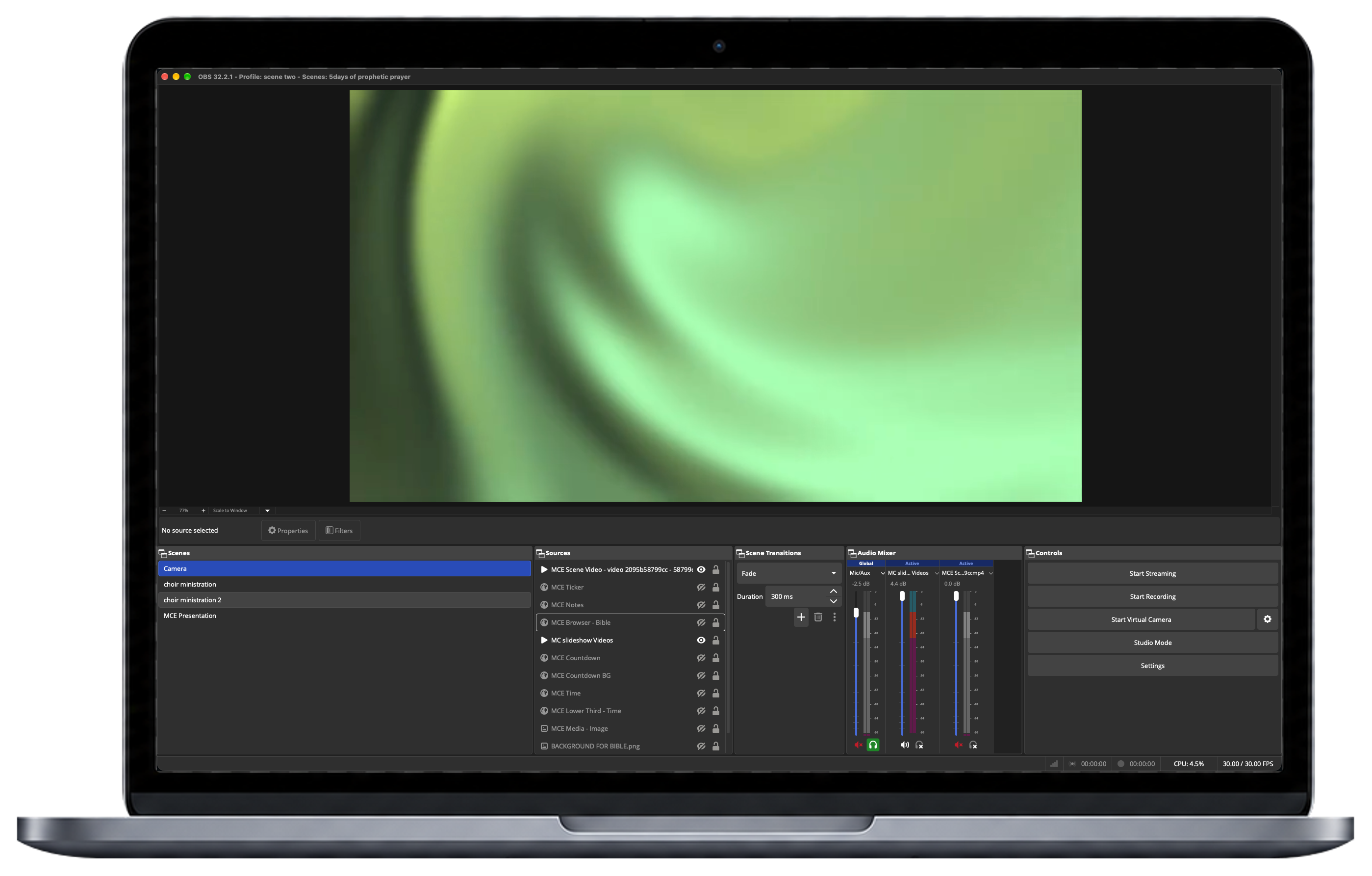 OBS Studio running on a laptop behind the tablet and phone